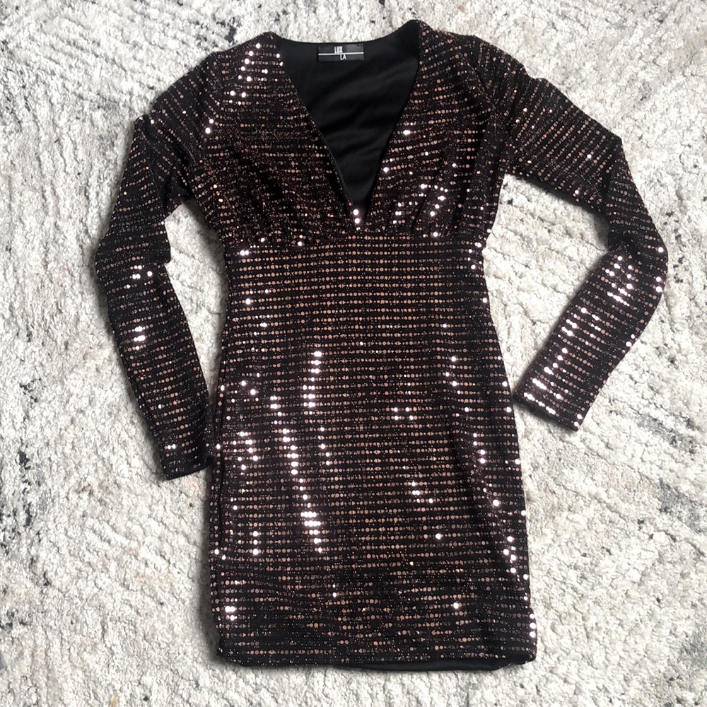 Shiny black mini dress, V cut